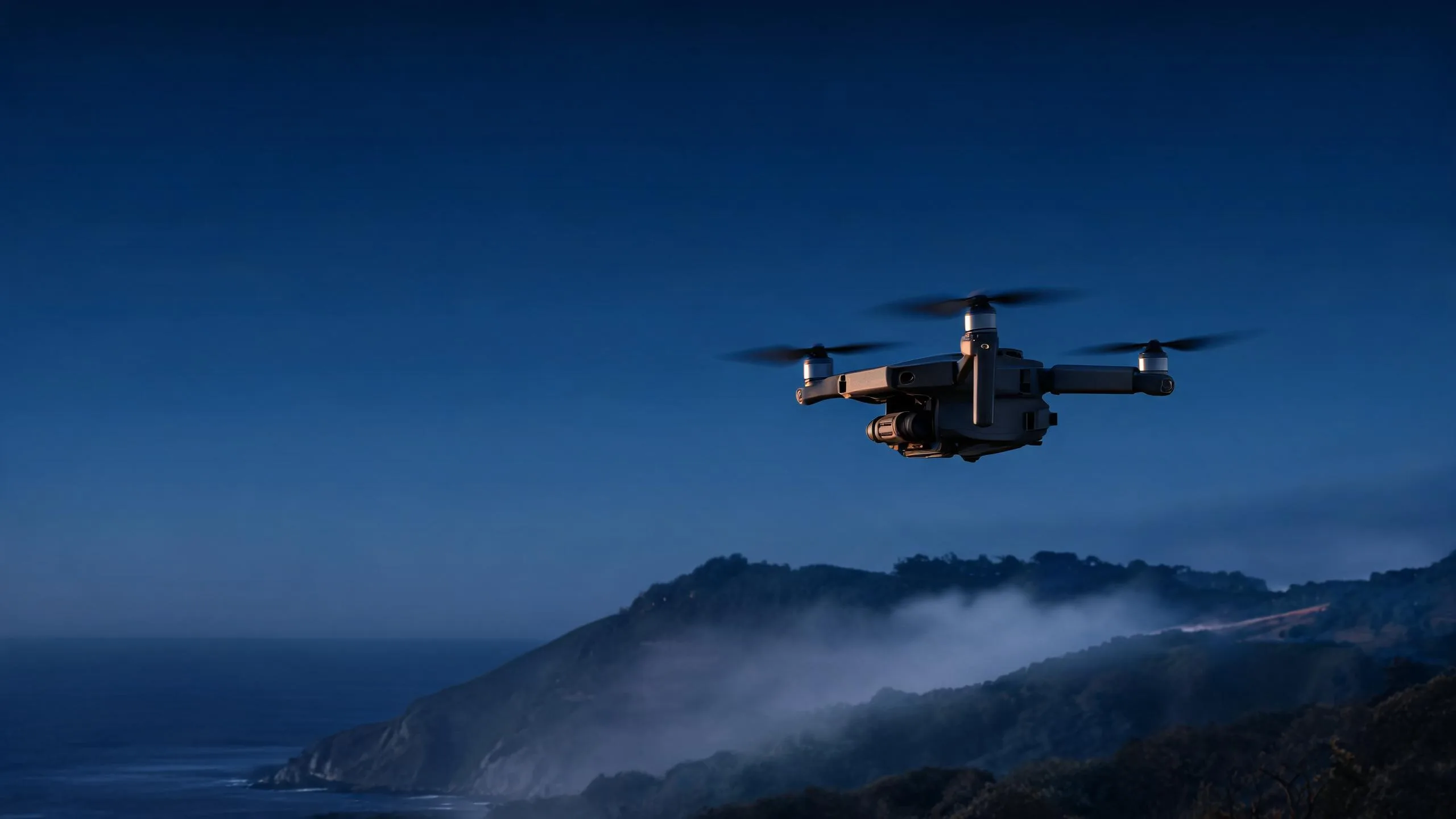 DOWELLIN drone flying above coastal mountains